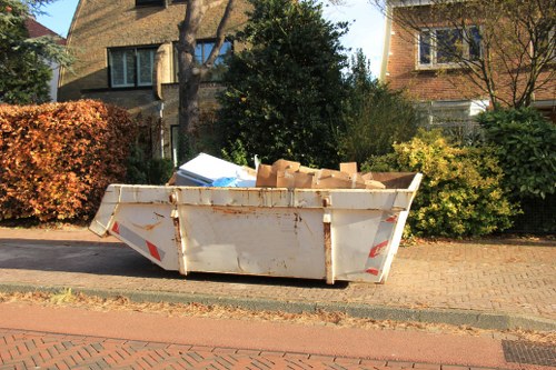 Workers sorting and segregating construction waste materials